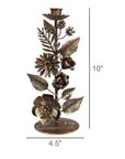 The HomArt Floral Taper Holder is a decorative metal candleholder featuring handcrafted flowers and leaves, measuring 10 inches tall by 4.5 inches wide—ideal for bringing old world charm to any room.