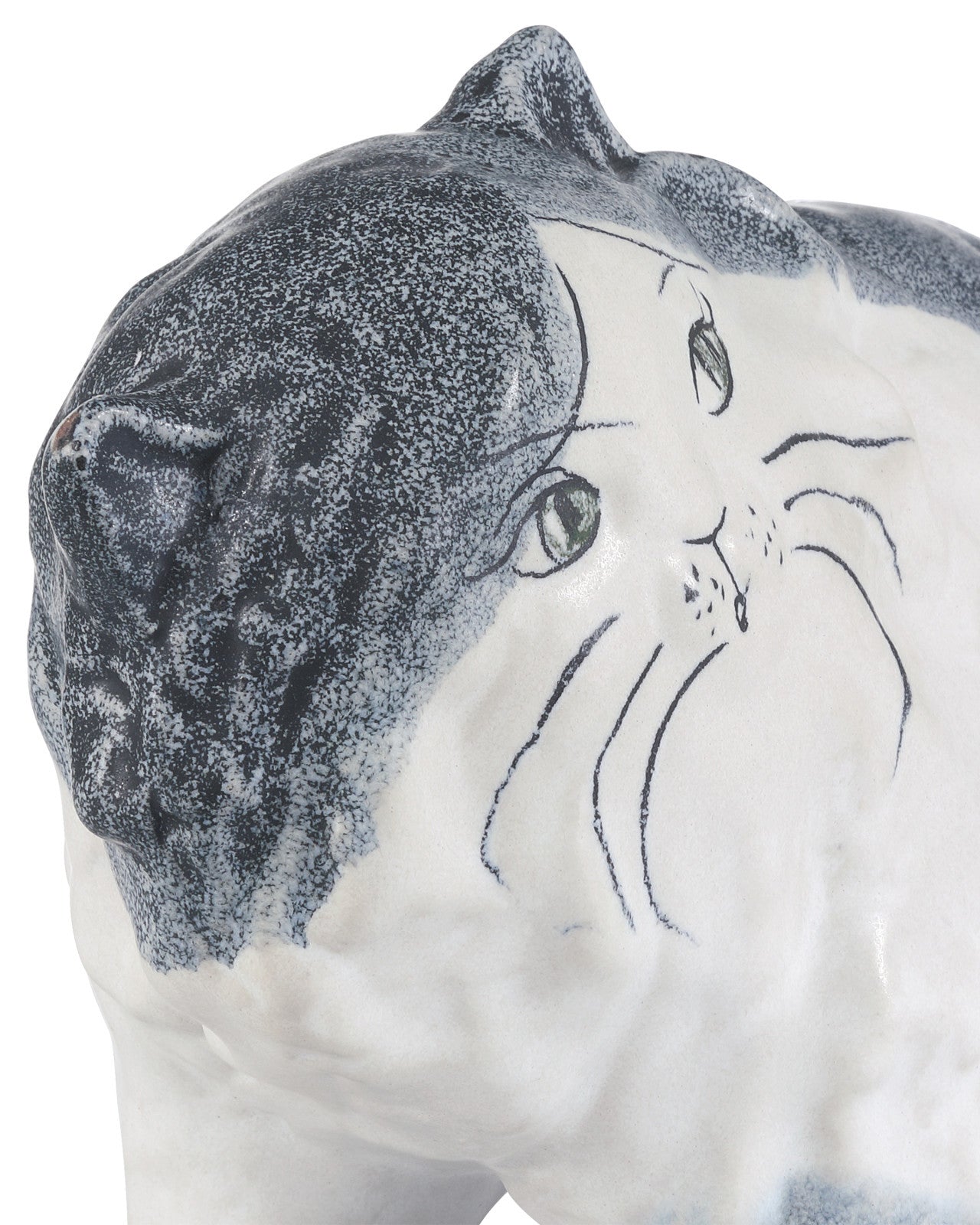 A close-up of the Currey & Company, Inc. Siamese Cat figurine, hand-painted with green eyes, black whiskers, and a textured speckled dark gray-and-white finish.