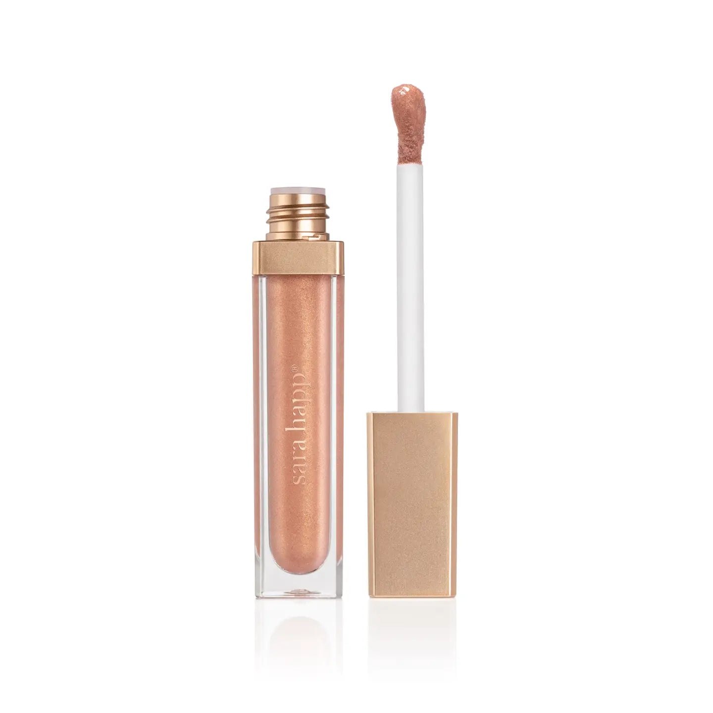 A partially open tube of Faire's Hydrating Lip Gloss, featuring a shimmery nude shade and gold cap, showcases its doe-foot applicator. Enriched with jojoba oil, the sleek design stands out against a plain white background.