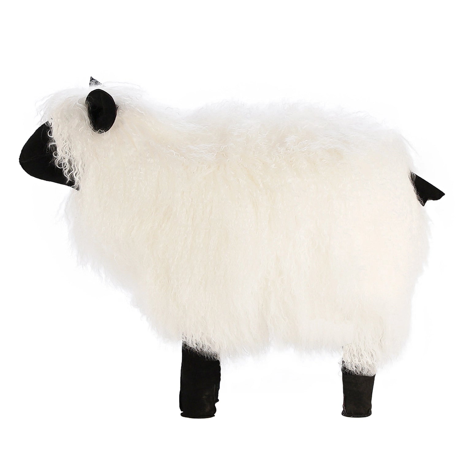 Faire's Tibetan Lamb Sheep features a fluffy white lamb body with black face, ears, and legs, shown in profile against a plain white background—an adorable nursery accessory.