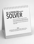 The Faire 52 Modern Manners white desk calendar displays “Be a Problem Solver” in bold black text, offering motivational advice to help kids and parents build confidence and independence for a brighter future.