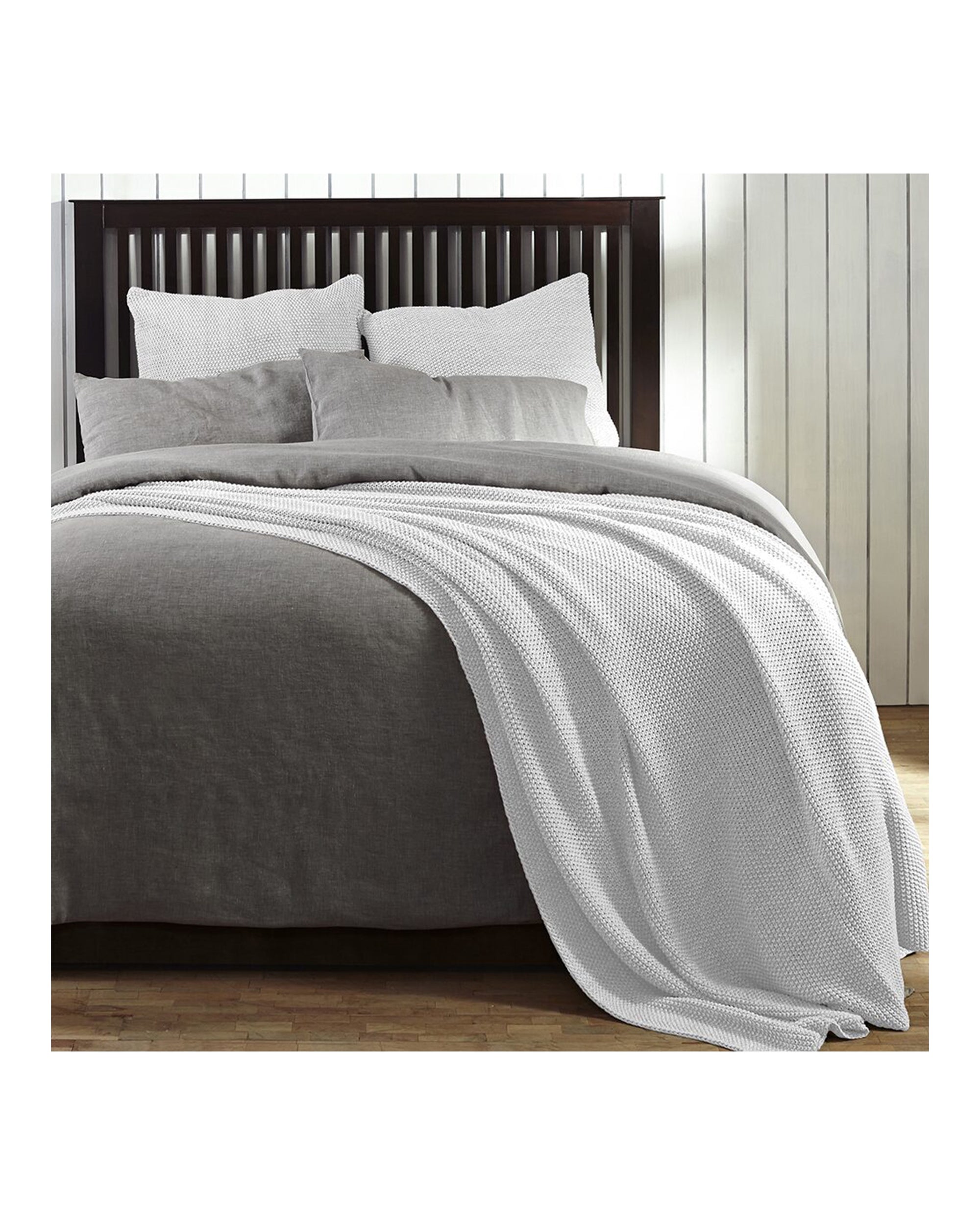 EGAN Coverlet by Amity Home in gray, elegantly draped on a neatly made bed with matching euro shams.