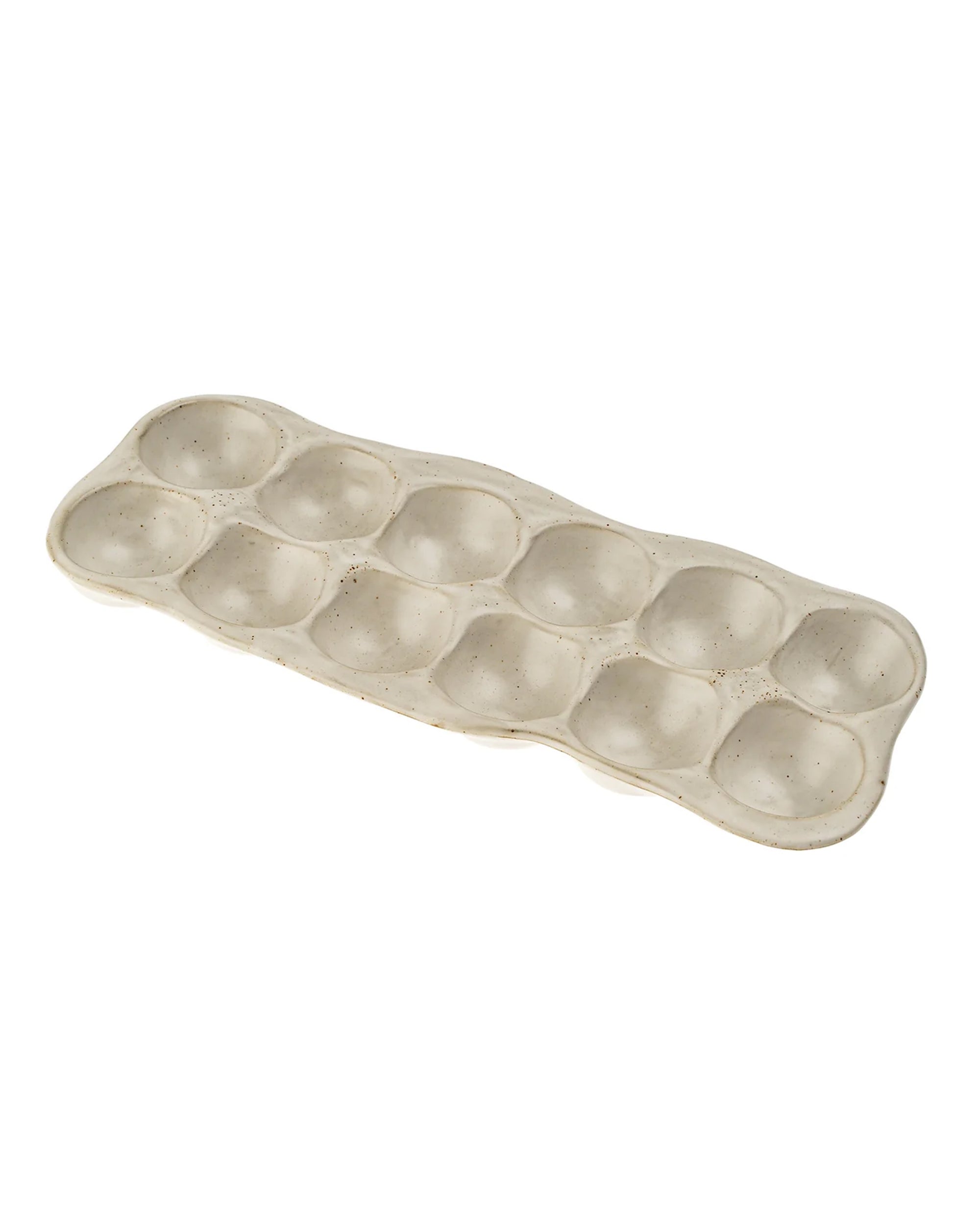 The Indaba 4-7207 Homestead Egg Holder is a beige ceramic tray with twelve rounded slots in two rows of six—ideal as a stylish kitchen accessory or practical egg holder.