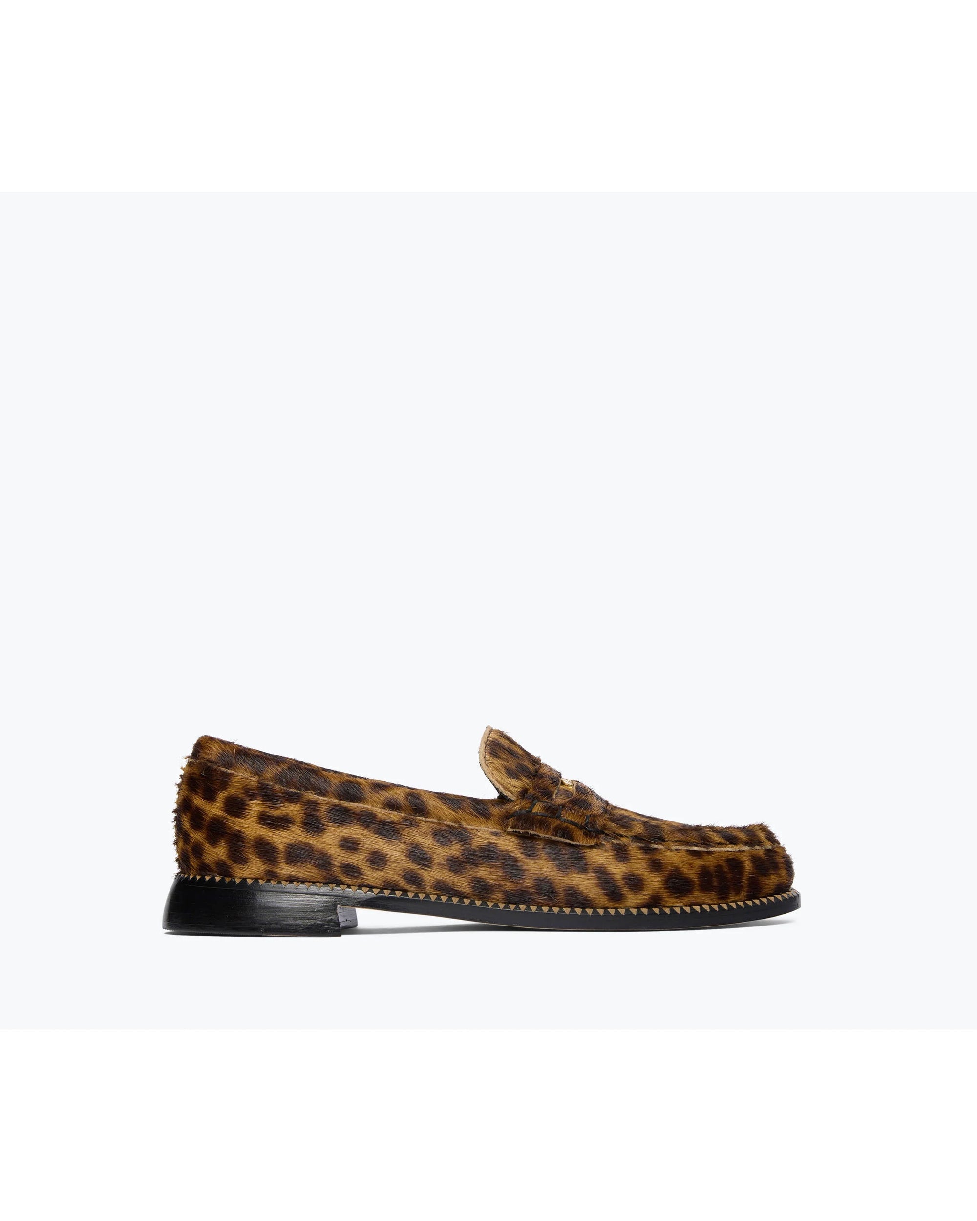 The Freda Salvador ELBA Leopard Loafer, crafted from leopard haircalf with a low leather-stacked heel and visible sole stitching, is shown against a plain white background.