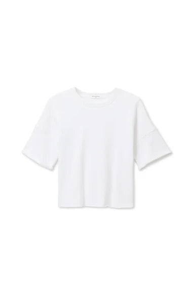 The French Terry SS Loose Sweatshirt by Perfectwhitetee is a plain white, boxy short-sleeve top with a relaxed fit and round neckline, shown on a white background—ideal for effortless everyday style with no visible patterns or logos.