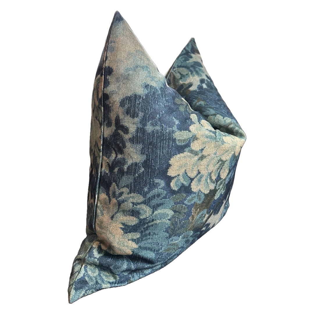 Blue and beige floral pillow with pointed corners by Faire, polyester cover, shown on white background.
