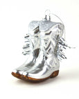The Faire Cowgirl Boot Ornament features shiny silver boots with decorative swirls, spiky accents, brown soles, and a hanging loop. This glossy Western décor adds festive charm to any tree.