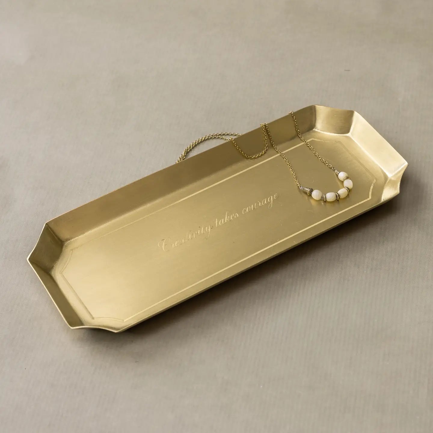 Brass desk tray with engraved Creativity Takes Courage, by Faire, elegant accent for jewelry or decor.