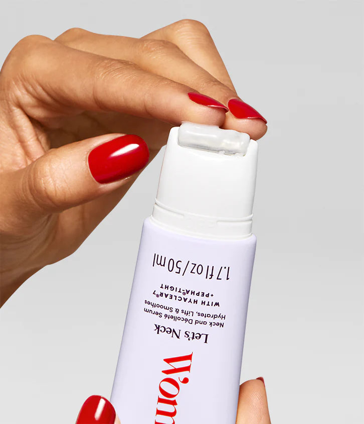A hand with red nails opens a white 1.7 fl oz (50 ml) Faire "Let's Neck - Neck Serum w/ Cooling Applicator" bottle, showing its roller tip for neck and décolleté. The background is plain gray.