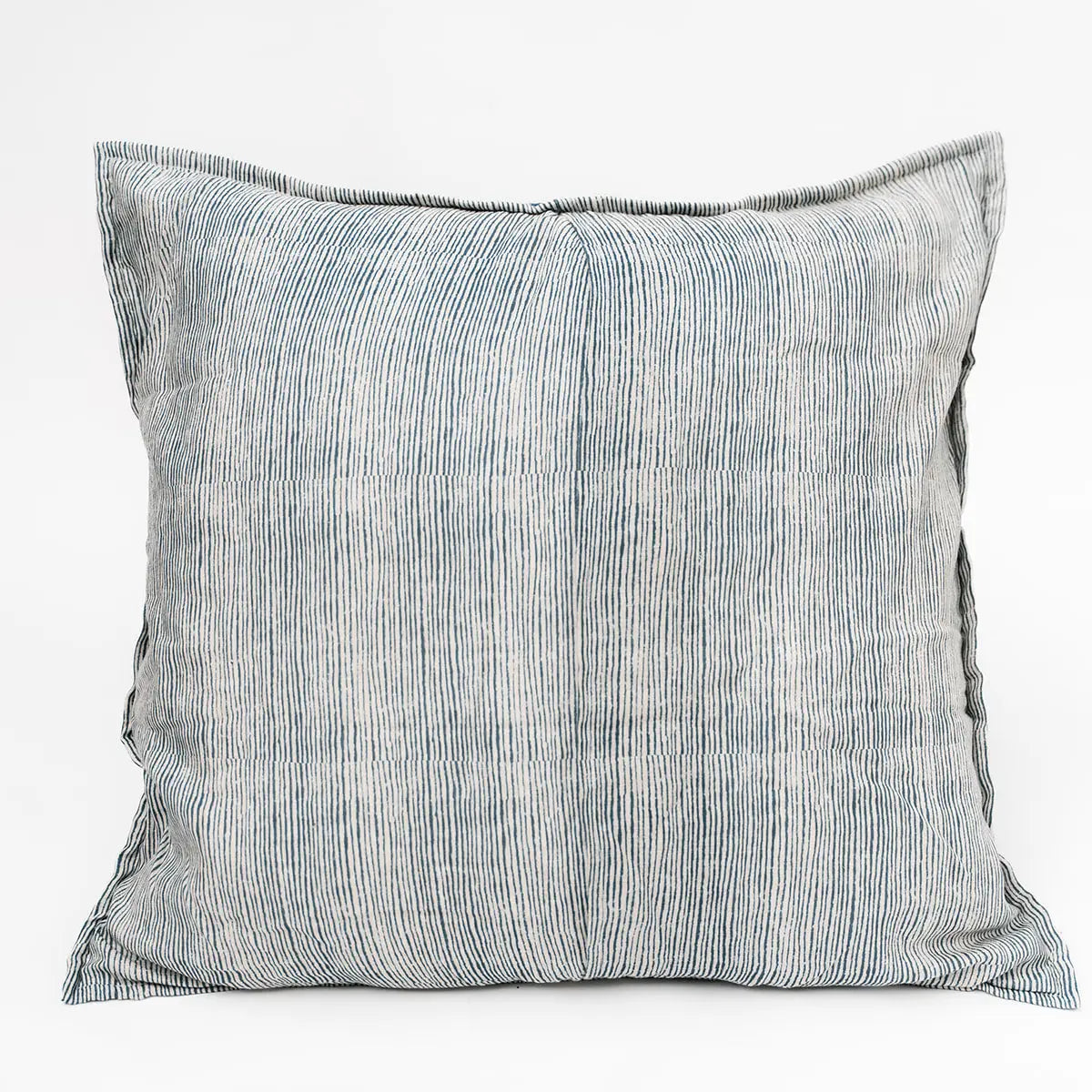 The Blossom Block Print Euro Sham by Faire features a subtle vertical blue and white pinstripe pattern on a light background, offering an elegant accent for artisan pillows or bohemian bedding on any plain white surface.