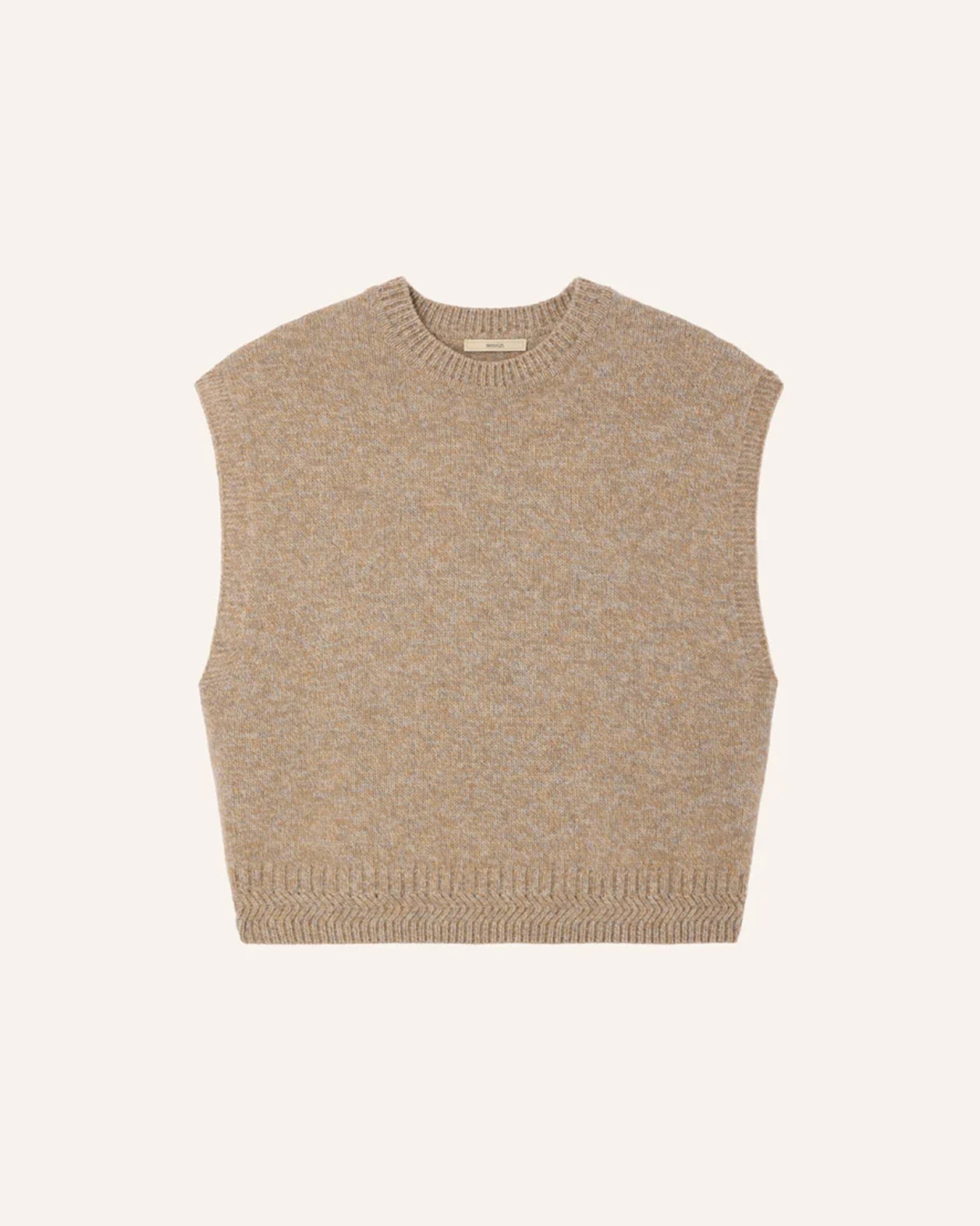 Beige merino wool sleeveless jumper by Sessun, laid flat on a light background at Bungalow Furniture &amp; Accessories.