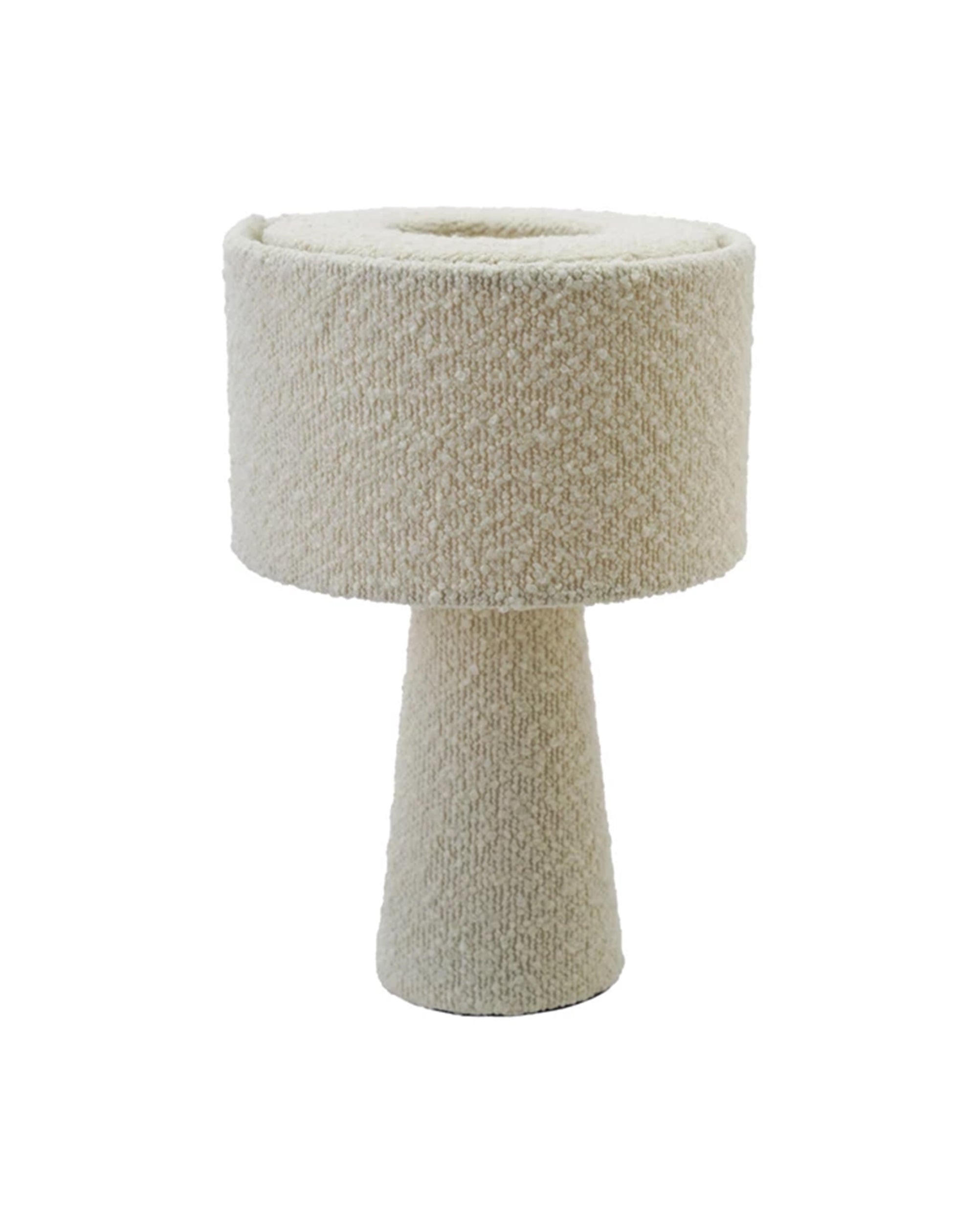 The Bloomingville Bouclé Ivory Fabric Table Lamp features a modern cylindrical base and drum-shaped shade in textured cream bouclé, set against a white background.