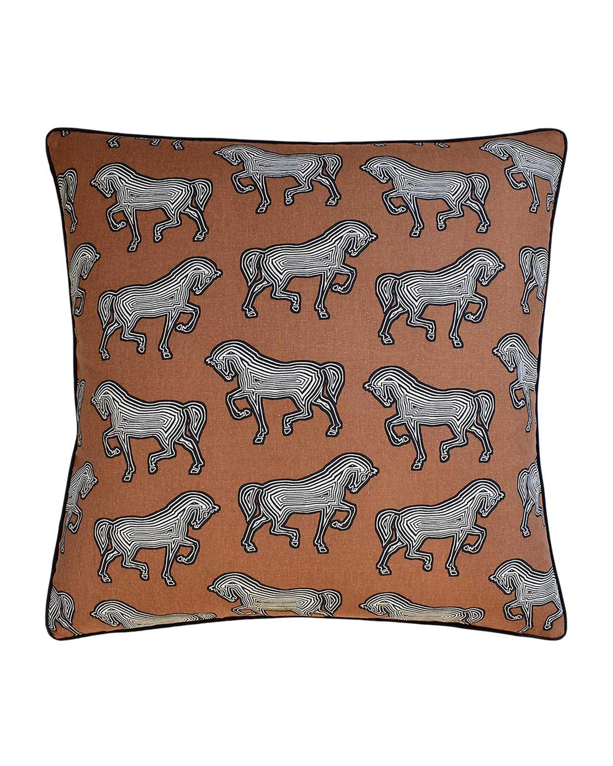 The Faubourg Brown Pillow by Ryan Studio features a rust background with stylized black and white zebras in wavy stripes, outlined in black, and is finished with elegant contrast piping.