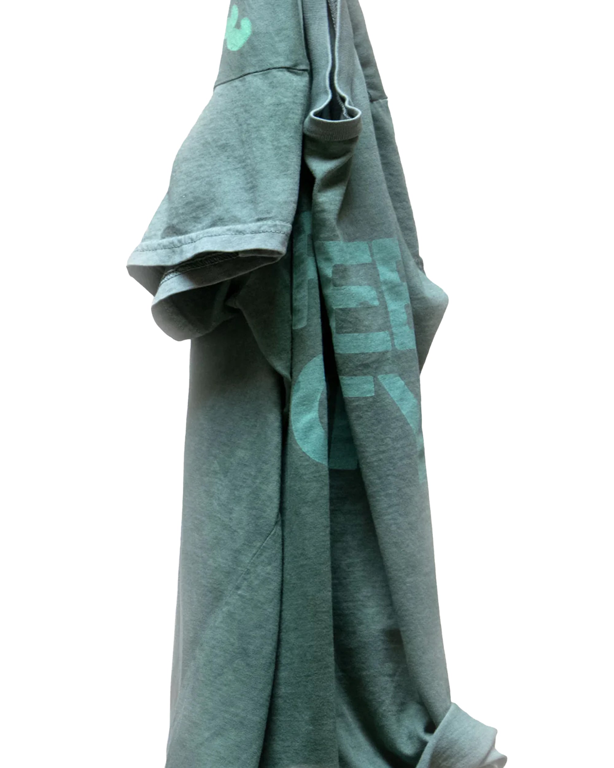 The FC thedoingofitis... SS Tee by Free City (sparrow, LLC) is a green unisex vintage t-shirt with light blue graphics. It hangs on a hook against a white background, draped to reveal part of the sleeve and hem.
