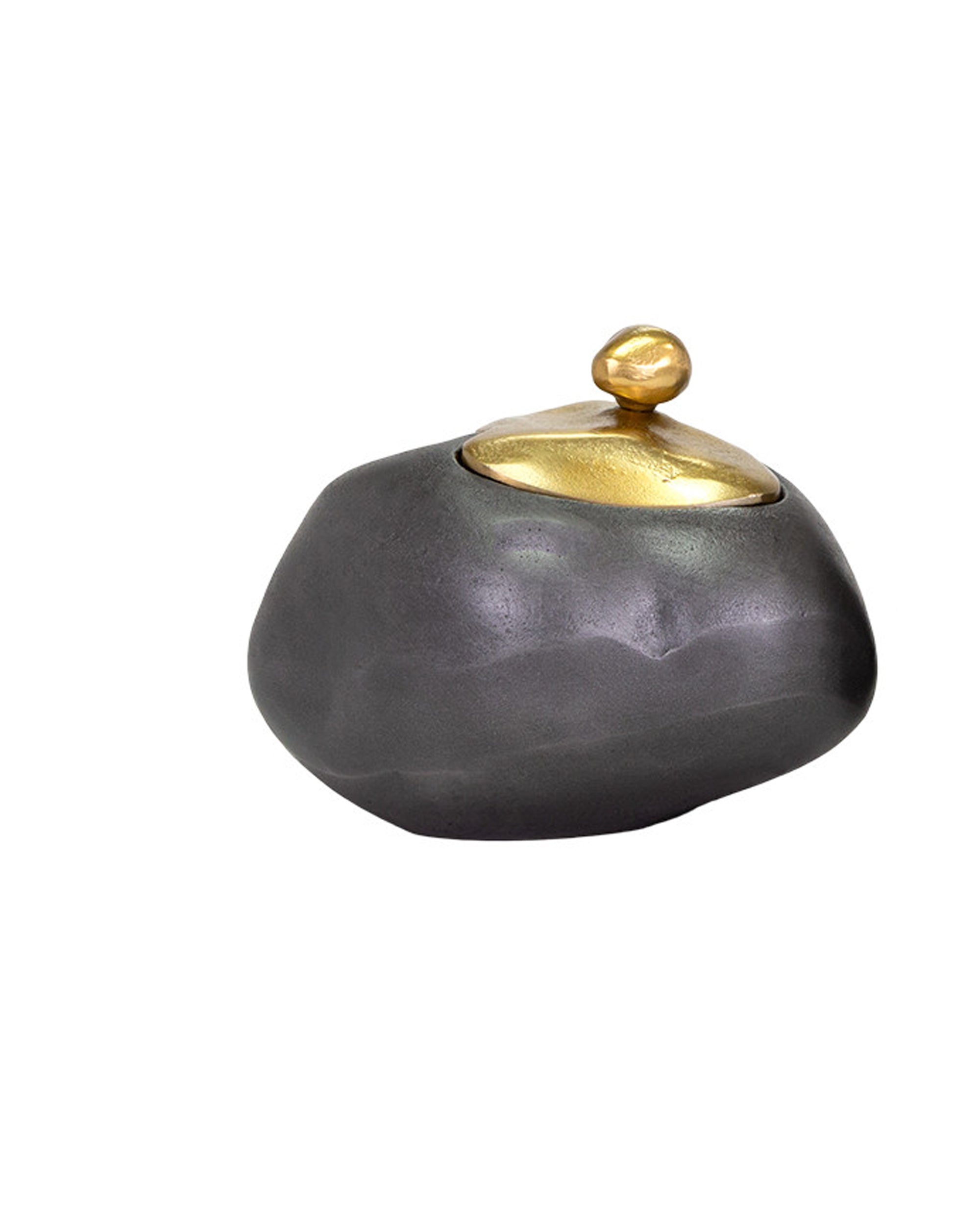 The Finkle Box by The Import Collection is a small, irregularly shaped dark gray container with a rounded gold-colored lid and knob, resembling a smooth stone with metallic accent—perfect for contemporary design lovers. Set on a white background.