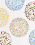 Six Faire Mixed Set Reusable Small Plates feature scalloped edges and unique Liberty print floral designs in pastel yellow, pink, blue, and green tones, arranged on a light background.