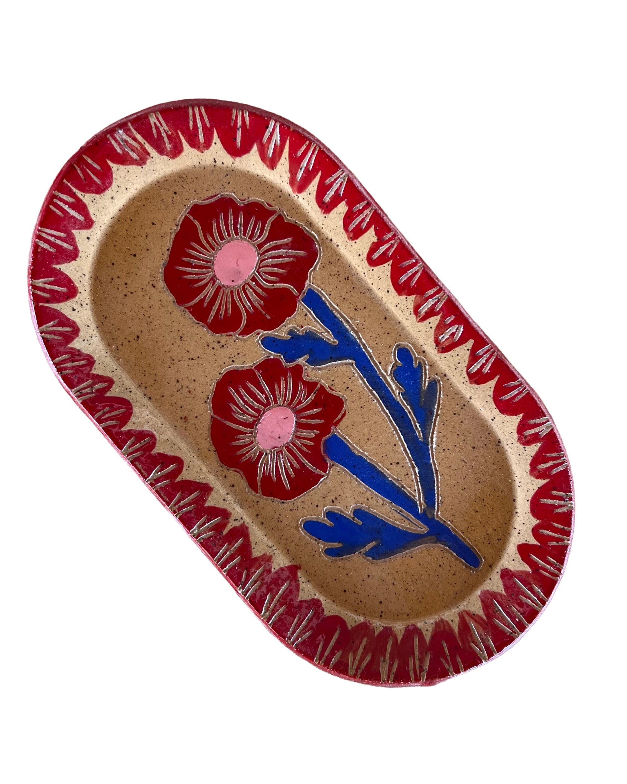 The Blossom Sgraffito Dish by Faire is a decorative ceramic piece with floral designs, ideal as a handmade jewelry dish or to add charm to any space.