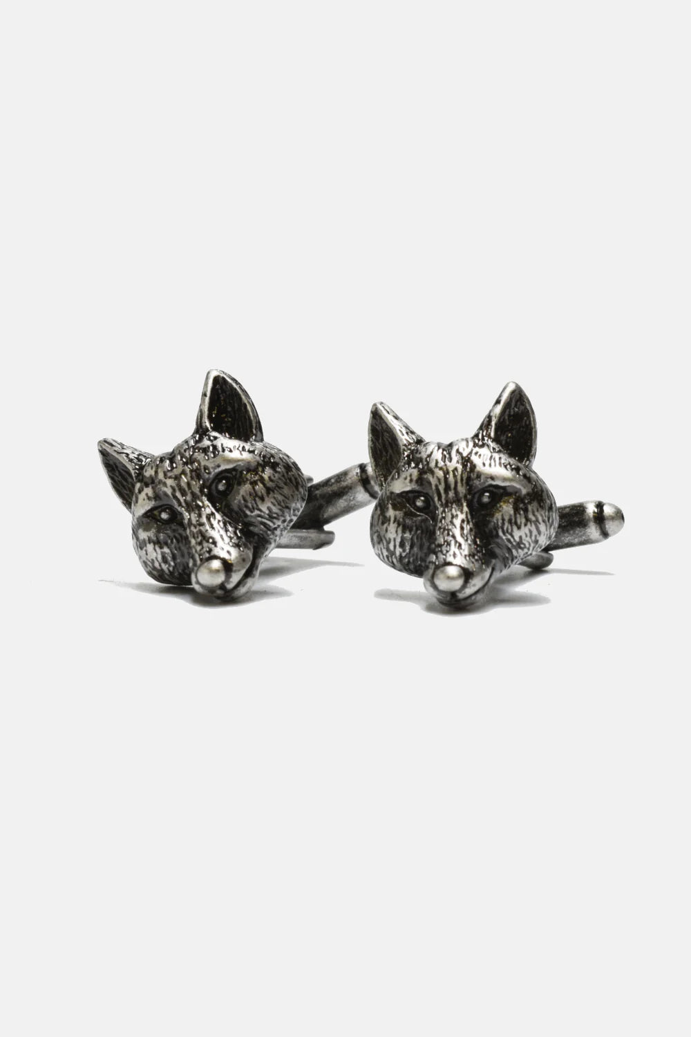 Curated Basics' MENS Cufflinks are silver-plated and designed in the shape of fox heads, showcasing intricate textures that replicate the look of fur. Each cufflink has a 3/4" diameter and is displayed against a simple white background.