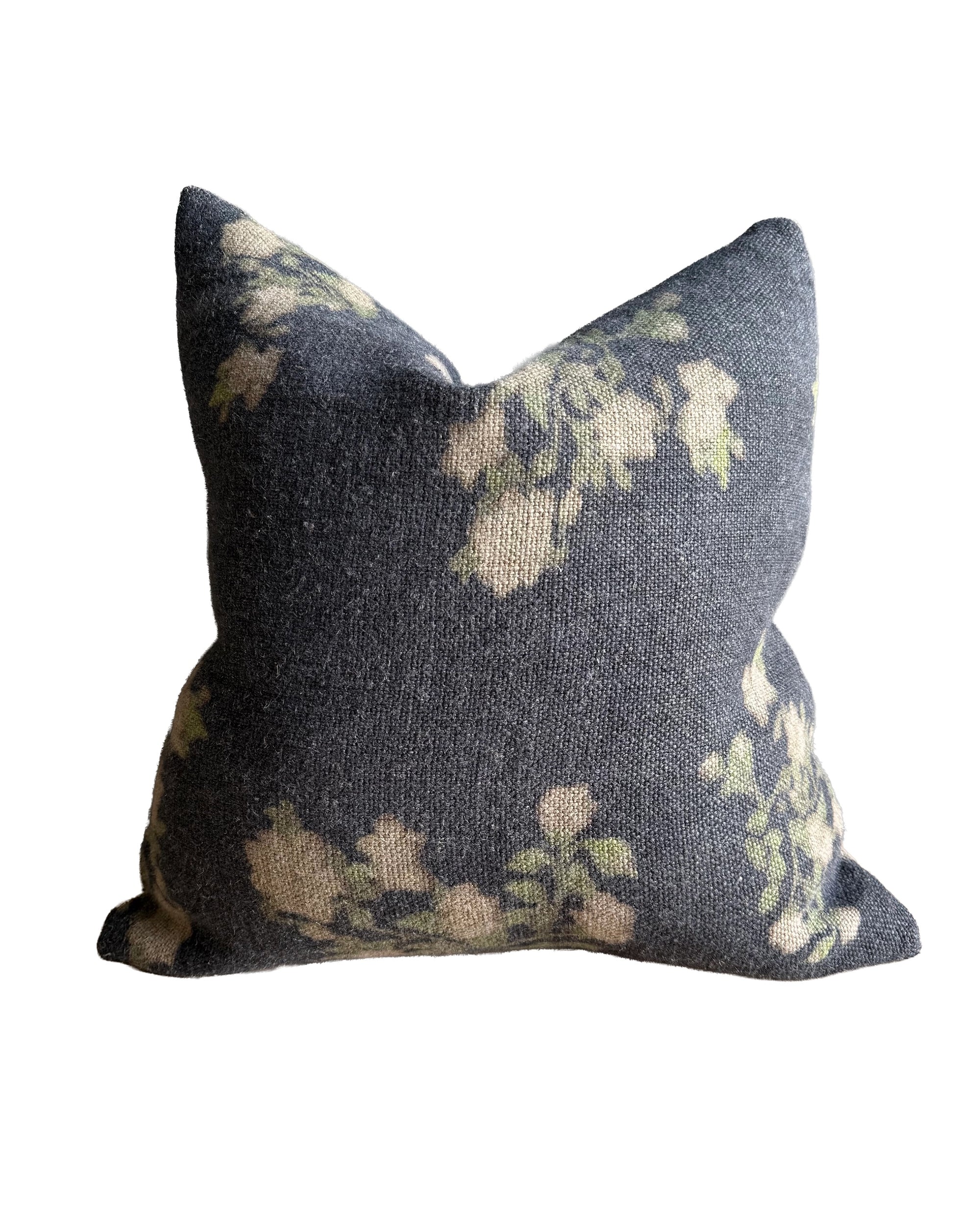 The Faire French Linen Roses Pillow features a dark gray stone-washed cover with a soft, subtle floral pattern in cream and green. This 26x26 pillow offers textured fabric and a relaxed, plush look—perfect for adding floral accents to any room.