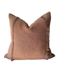 The Fringe Accent Pillow Havane 22x22 features textured dusty rose fabric and fringe on two sides, evoking classic linen style. Isolated on a white background.