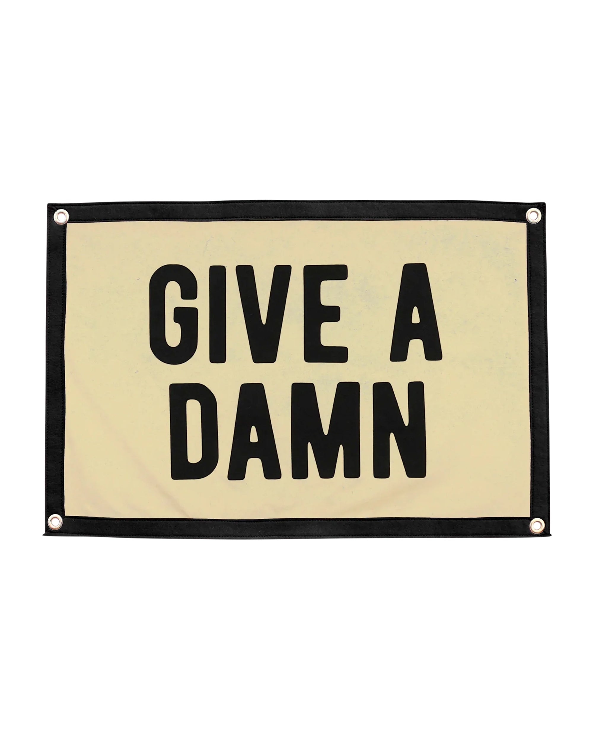 The Oxford Pennant "Give A Damn Camp Flag 15x22" features a beige background, black border, and bold black all-caps lettering—ideal as motivational decor or an inspirational banner for any space.