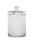The Creative Co-op DF9421 Glass Jar w/ Lid features a clear round design with a matching lid and handle, making it an ideal decorative storage jar. Displayed empty against a white background.