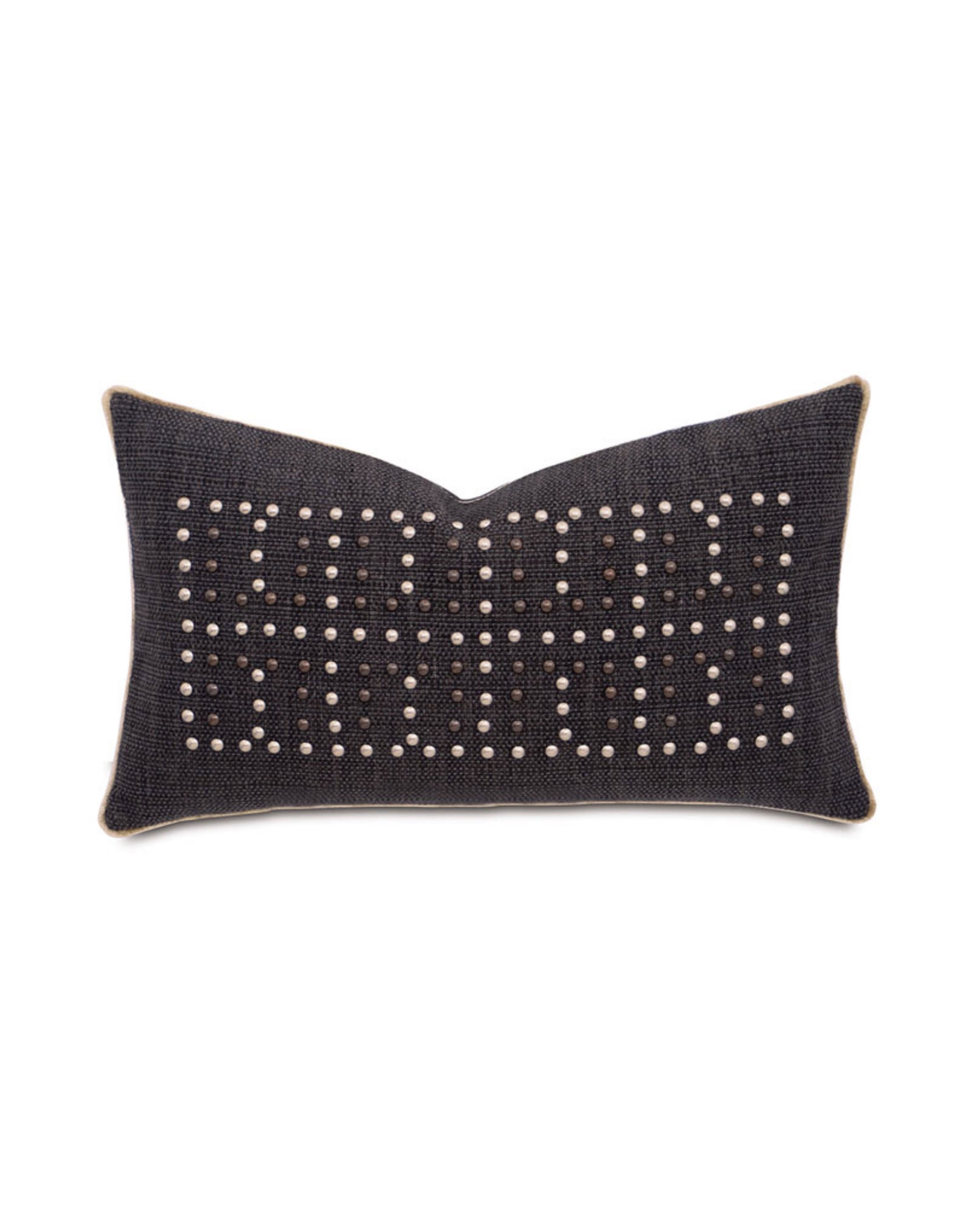 The GILMER CHARCOAL pillow by Eastern Accents is a rectangular, dark gray design featuring rows of small, light studs arranged in a bold geometric pattern on the front.