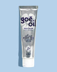 A silver tube of Goe Oil by Jao Limited with purple and black text and a white cap stands upright on a light blue background, featuring a white flower design behind it. Perfect for moisturizing and hydrating skin.