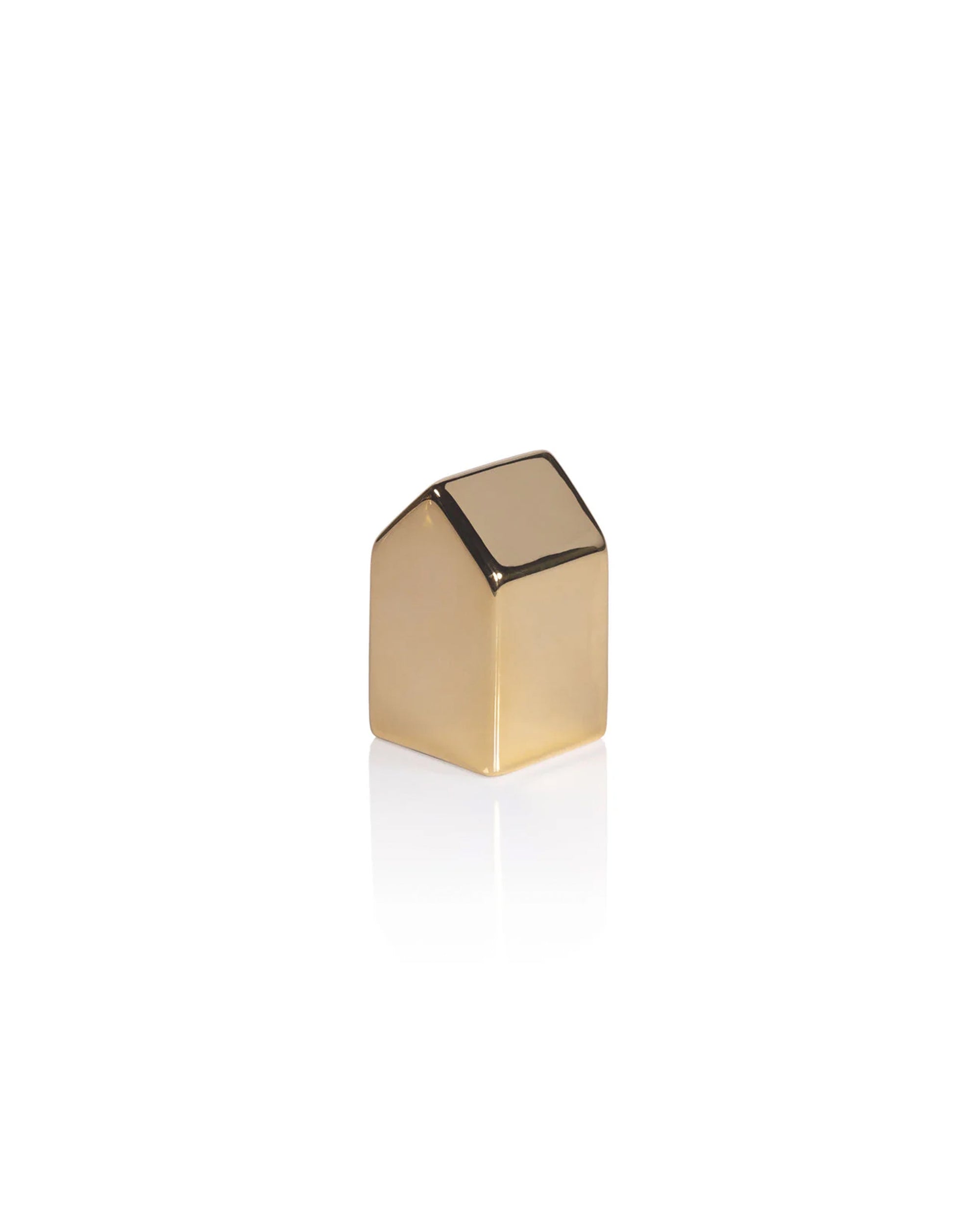 The Zodax Ceramic House Gold L, a small, shiny decorative piece shaped like a simple gold house, sits on a white background with a slight reflection—perfect for festive holiday decor.