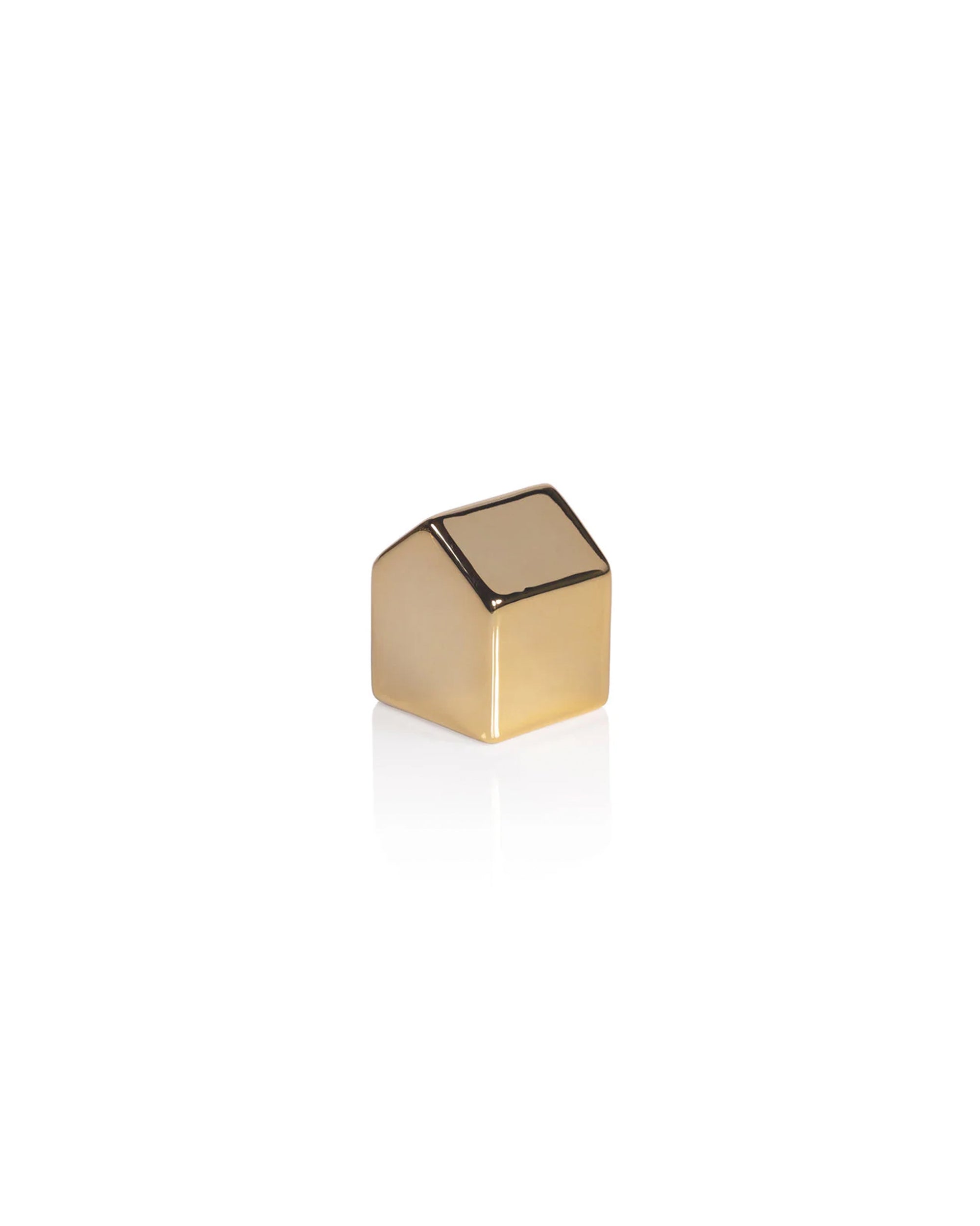 The Zodax Ceramic House Gold M is a small, shiny, metallic gold ceramic house featuring a minimalist slanted roof design—perfect for adding stylish holiday decor to your space.
