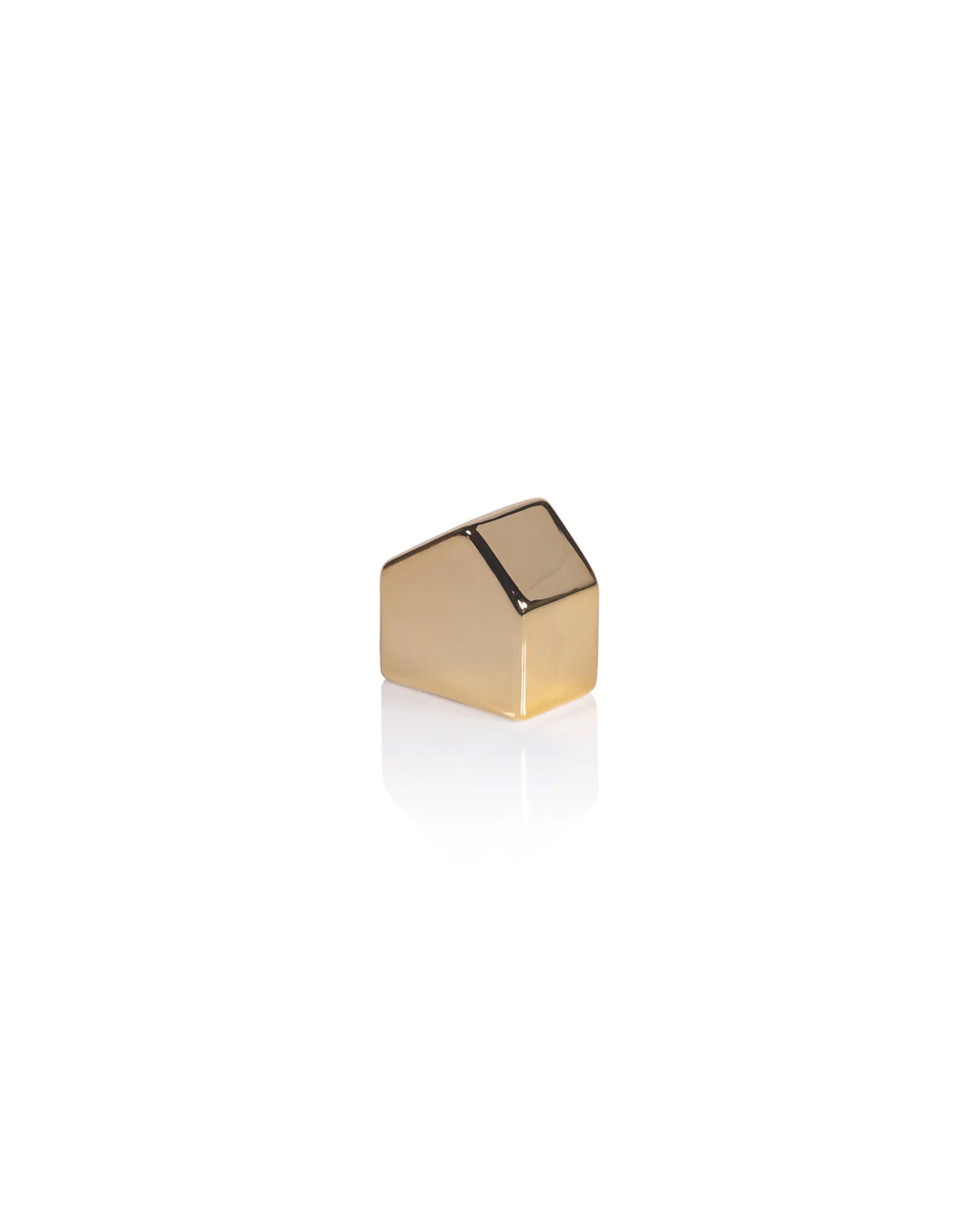 The Zodax Ceramic House Gold S, a single gold-toned keycap with a slanted top, is showcased isolated on white with a subtle reflection, adding festive charm reminiscent of decorative ceramic house accents.