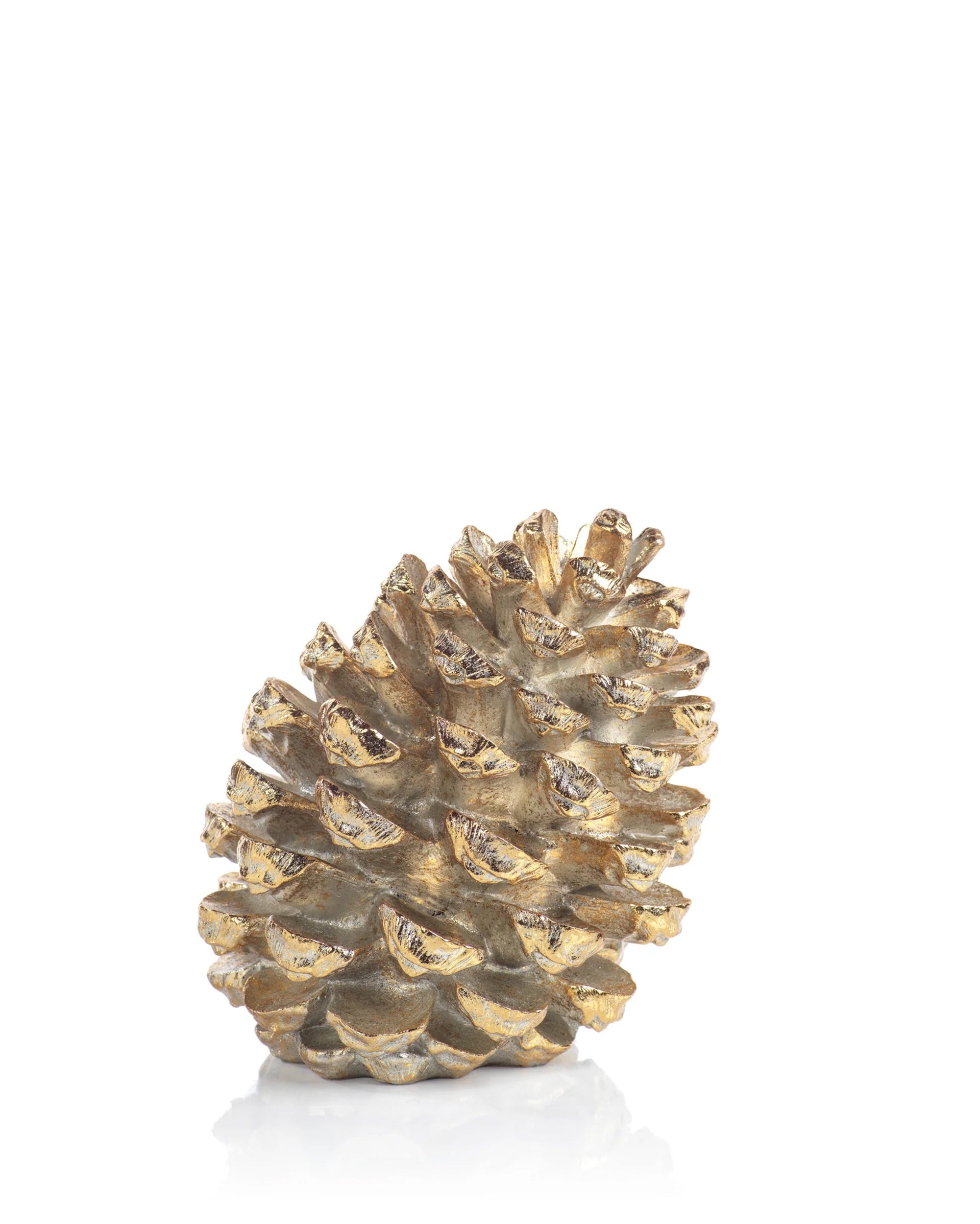 The Zodax Gold Pine Cone 11" stands upright on a white reflective surface against a clean white background—an elegant accent for home decor.