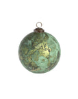 The Creative Co-op Marbled Glass Ornament is a round glass and iron piece with a green marble pattern and gold finish, featuring a metal cap and hanging loop, displayed against a white background.