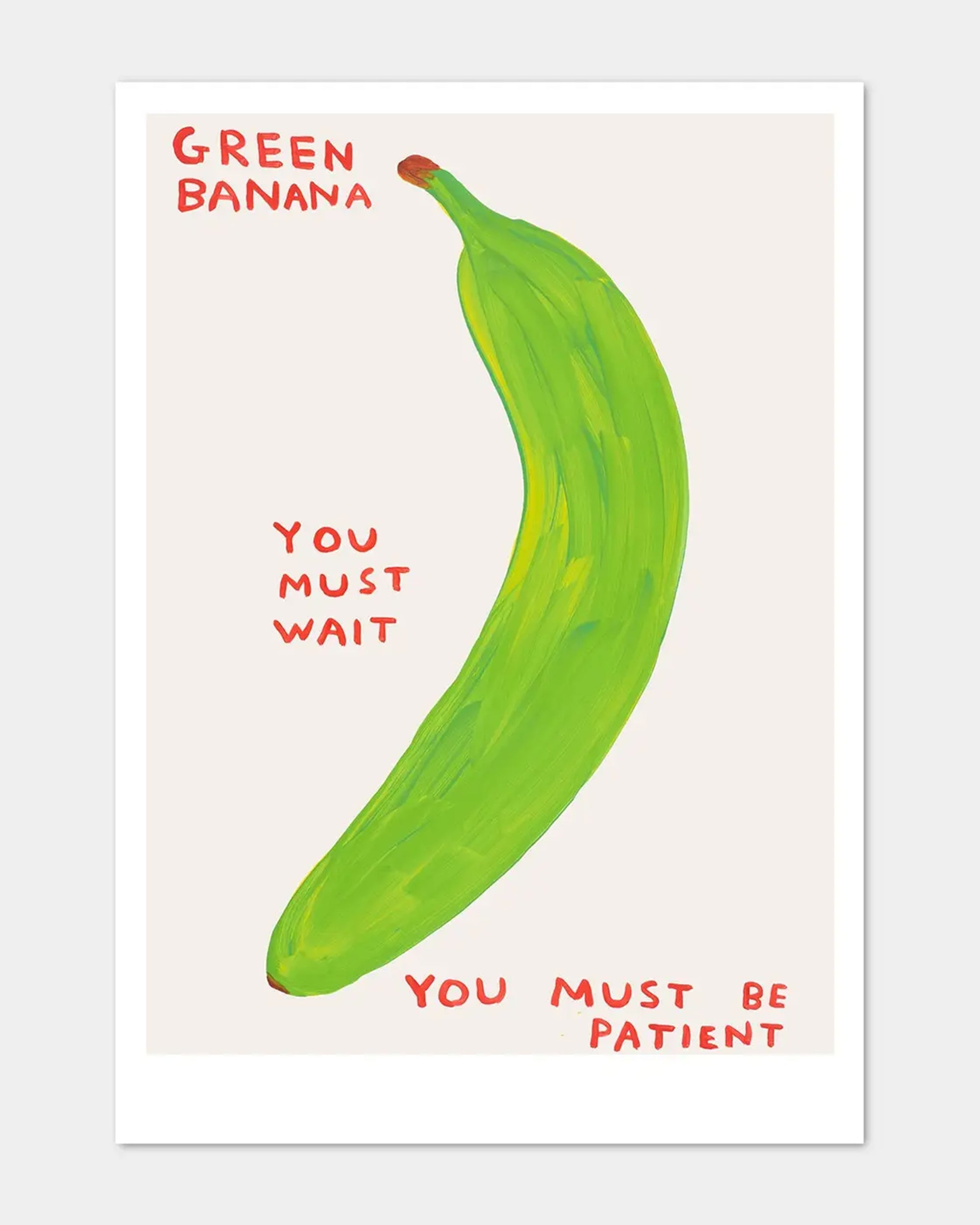 A painting of a bright green banana with bold red text, "GREEN BANANA. YOU MUST WAIT. YOU MUST BE PATIENT." on a plain background—just like the Green Banana postcard by Faire.