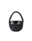 The Accent Decor Tricks & Treats Basket is a small, dark gray felt Halloween basket with a handle, embroidered cat face details, pointy ears, yellow eyes, pink inner ears, and white whiskers—ideal for trick-or-treating or festive decor.