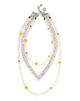 The Venessa Arizaga Happy Dream Necklace 16-26" is a silver-plated double-strand necklace with white freshwater pearls, clear rhinestones, smiley face beads, yellow and metallic accents, and a secure clasp.