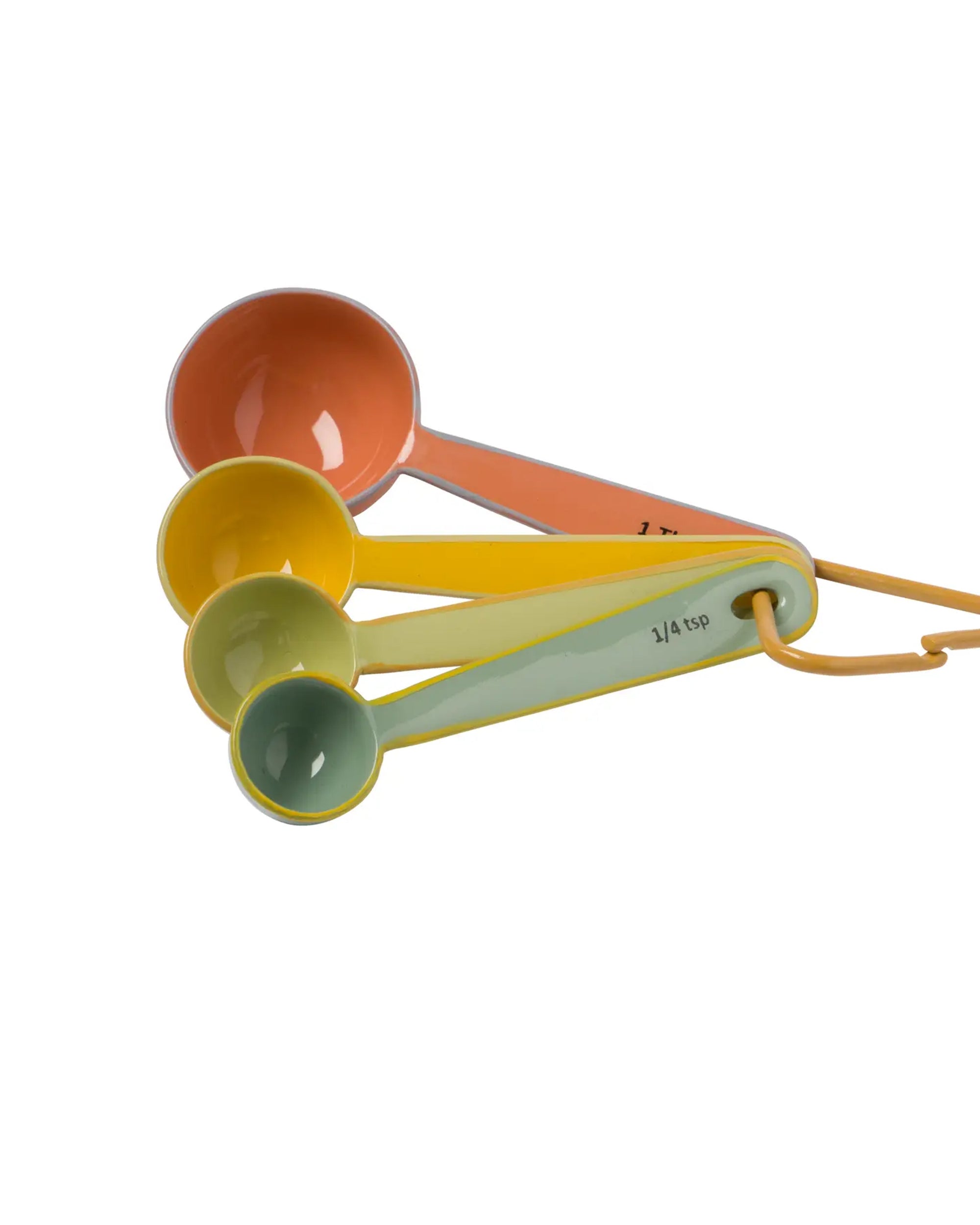 The Harlow Bright Measuring Spoons by Be Home include four food-safe enamel spoons in orange, yellow, green, and light yellow, stacked together on a yellow ring—perfect colorful additions to your serveware collection.