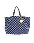 The KR Heart in Check Tote by Kerri Rosenthal features a blue and white houndstooth cotton canvas, two handles, and a yellow heart keychain—perfect for stylishly carrying your daily essentials.