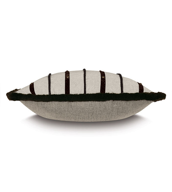 The Eastern Accents Highland Stripe Pillow features beige fabric with dark vertical stripes, button accents, and a dark green border along the sides. Shown here from a side view.