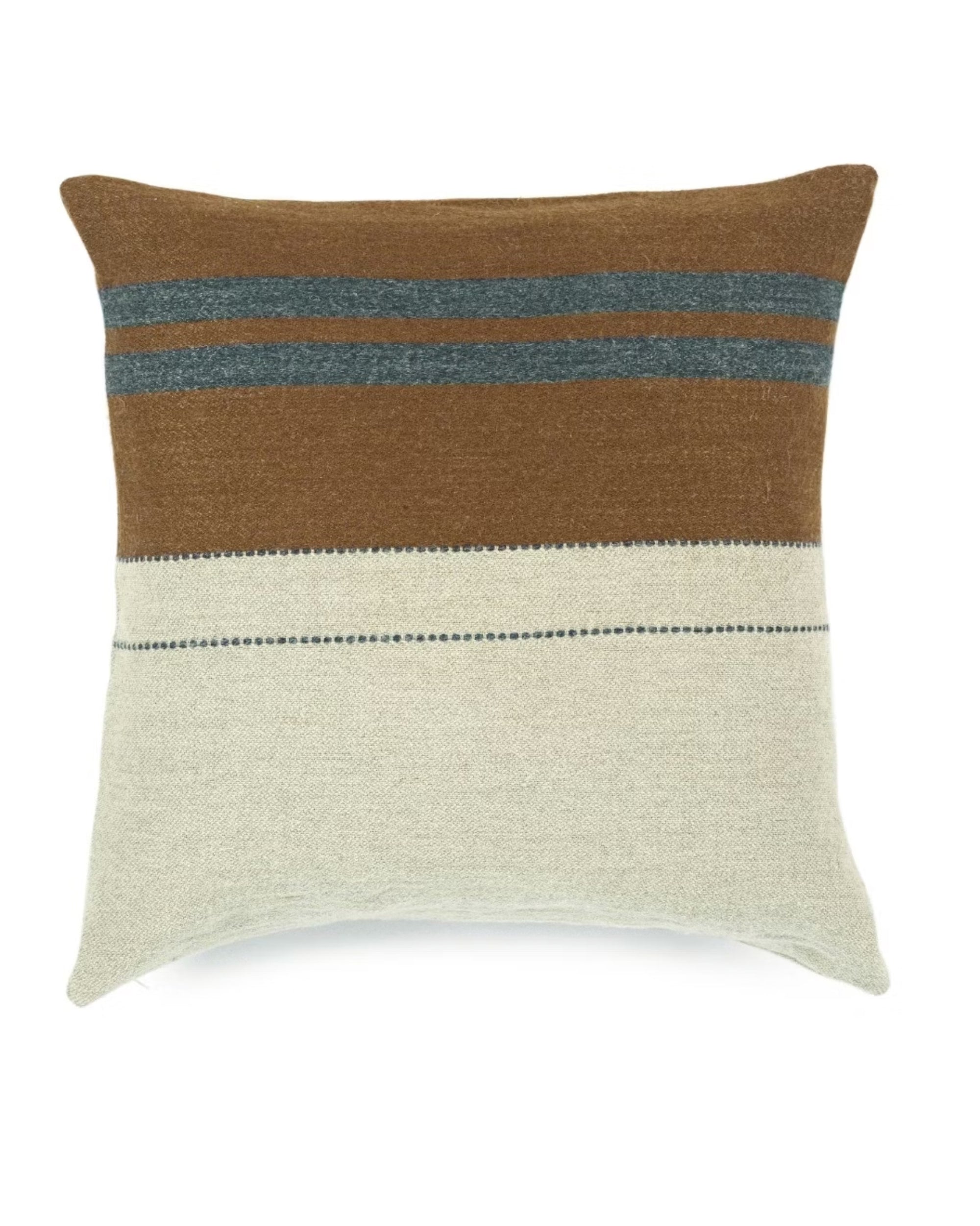 The Highland Stripe Pillow by Libeco Home features a brown upper half with three dark blue stripes and an off-white lower half highlighted by a dotted blue stripe near the center.