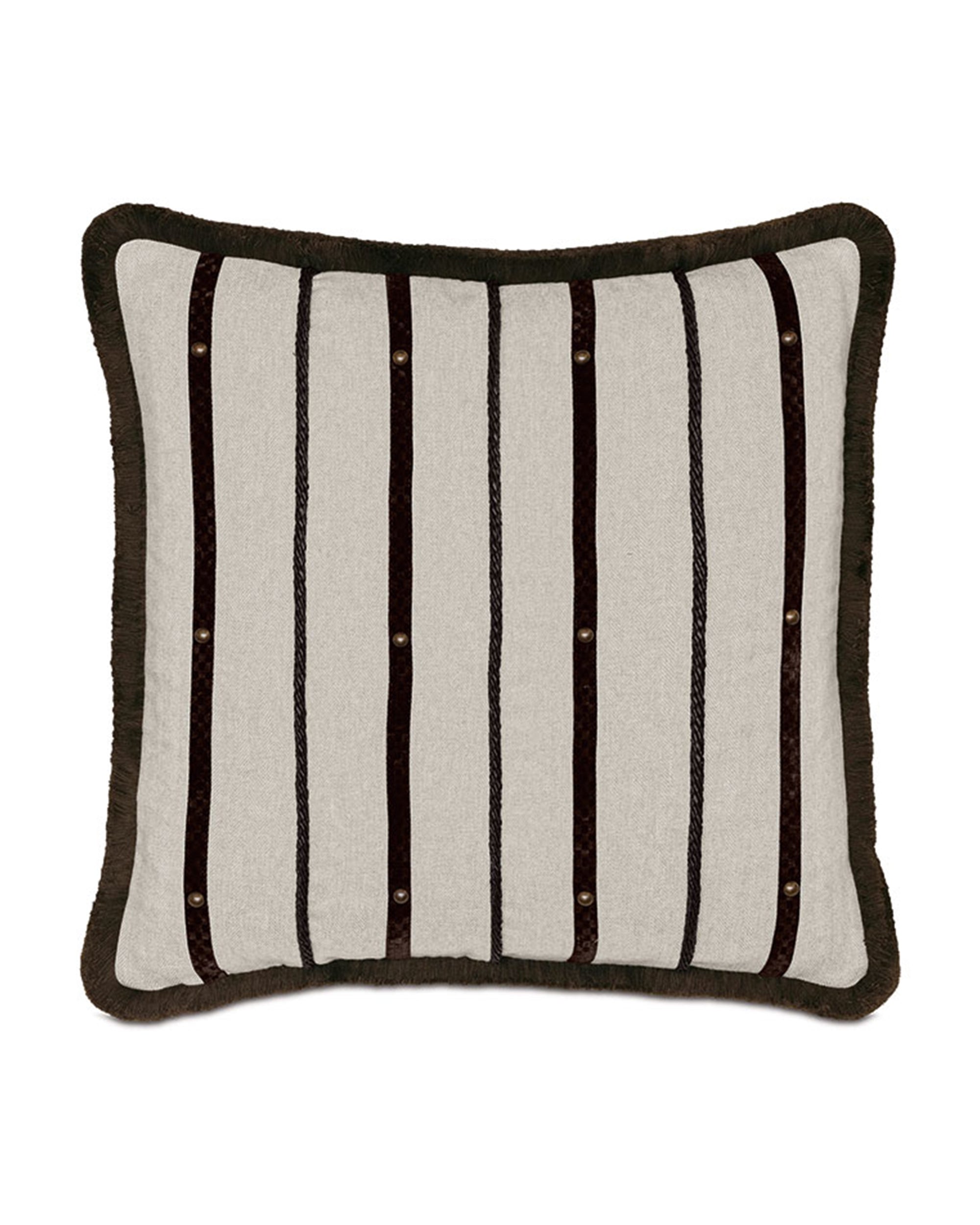 Elevate your space with the Eastern Accents Highland Stripe Pillow, featuring a beige background, dark brown vertical stripes, round studs, and a textured border. Perfectly complements the Highland bedding collection.