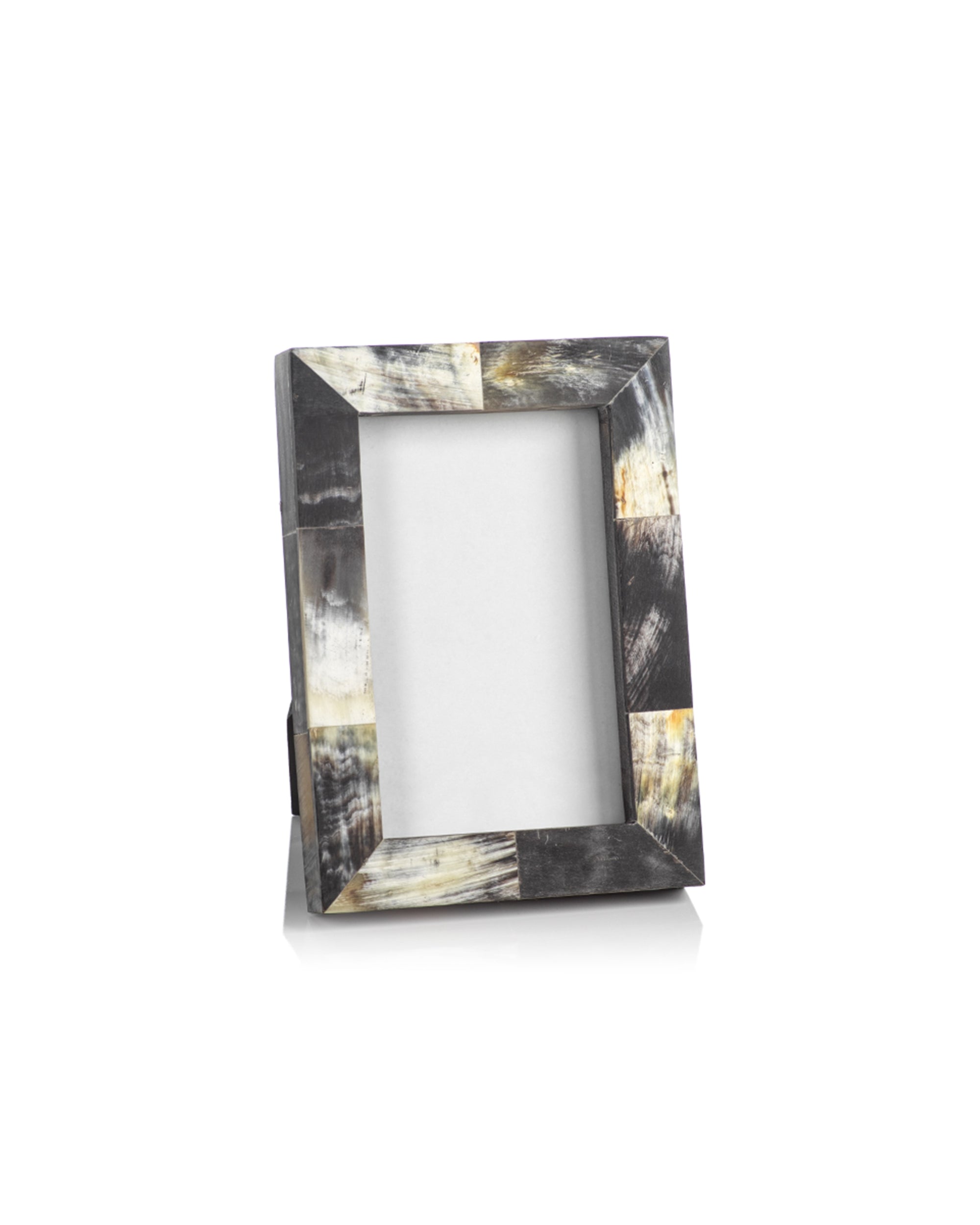 The Zodax IN-6707 Horn Photo Frame 4x6 is a rectangular frame featuring a glossy, marbled black, white, and yellow design with a stand, elegantly displayed on a white background.
