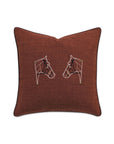 The EQUESTRAIN decorative pillow by Eastern Accents is square and brown with black piping, featuring two white embroidered horse heads with gold accents facing each other on a plain background.