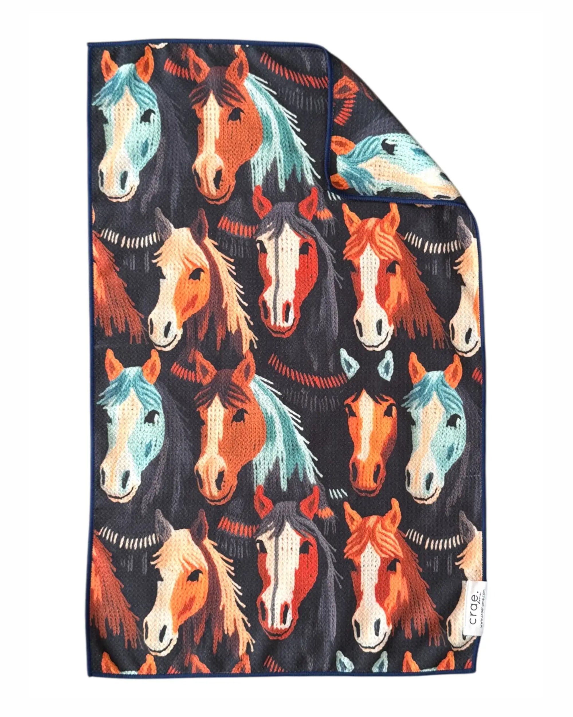 Double-sided hand towel with vibrant horse head print by Faire Laurice, dark background, waffle microfiber.
