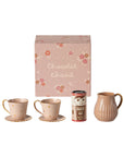 Maileg Mini Hot Chocolate Set with two cups, saucers, beige pitcher, pretend powder, and pink floral box.