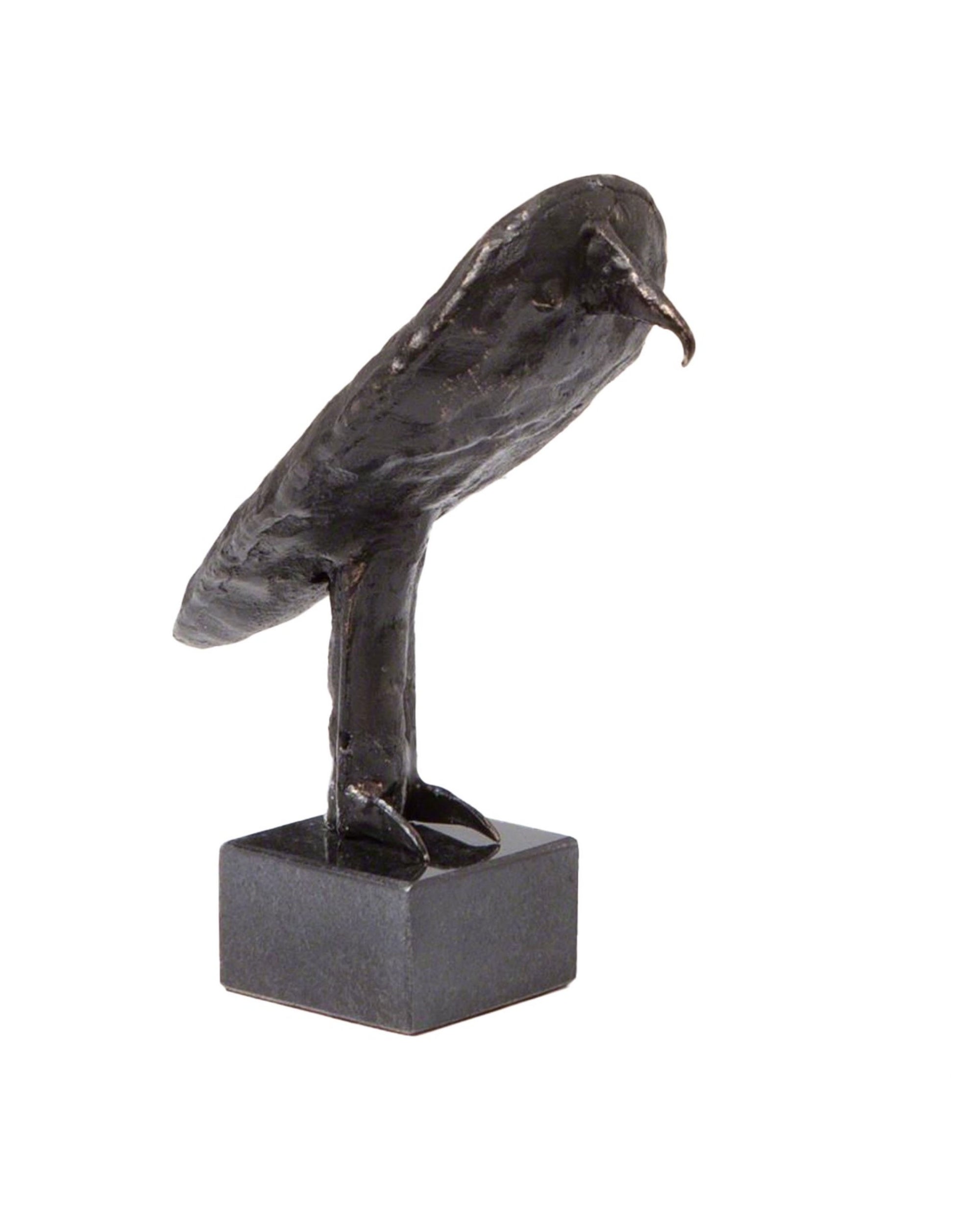 The "I'm an Owl" sculpture by Global Views features a small, minimalist black owl standing upright on a square black granite pedestal with a smooth finish and simple details representing its beak, wings, and feet.