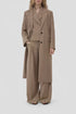 CLOSED wide-leg suit and blazer in neutral tone, minimal style against plain backdrop.