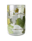 The HomArt Enameled Hurricane / Ivy clear glass tumbler features green and yellow vine leaves with winding stems, evoking the look of an ivy enameled glass garden luminary.