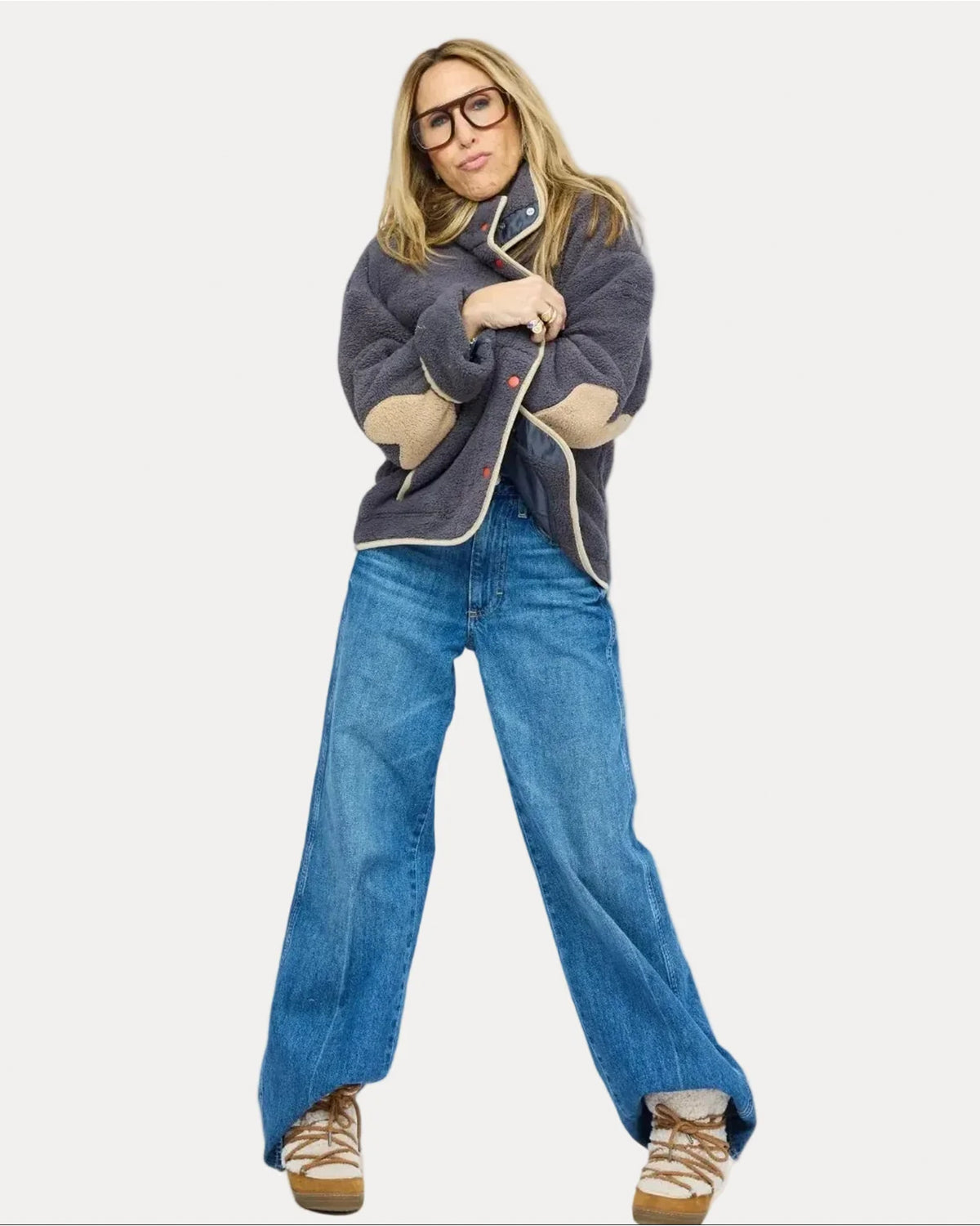 Kerri Rosenthal Coze Magoze anthracite jacket styled with blue jeans and brown sneakers on a white background.