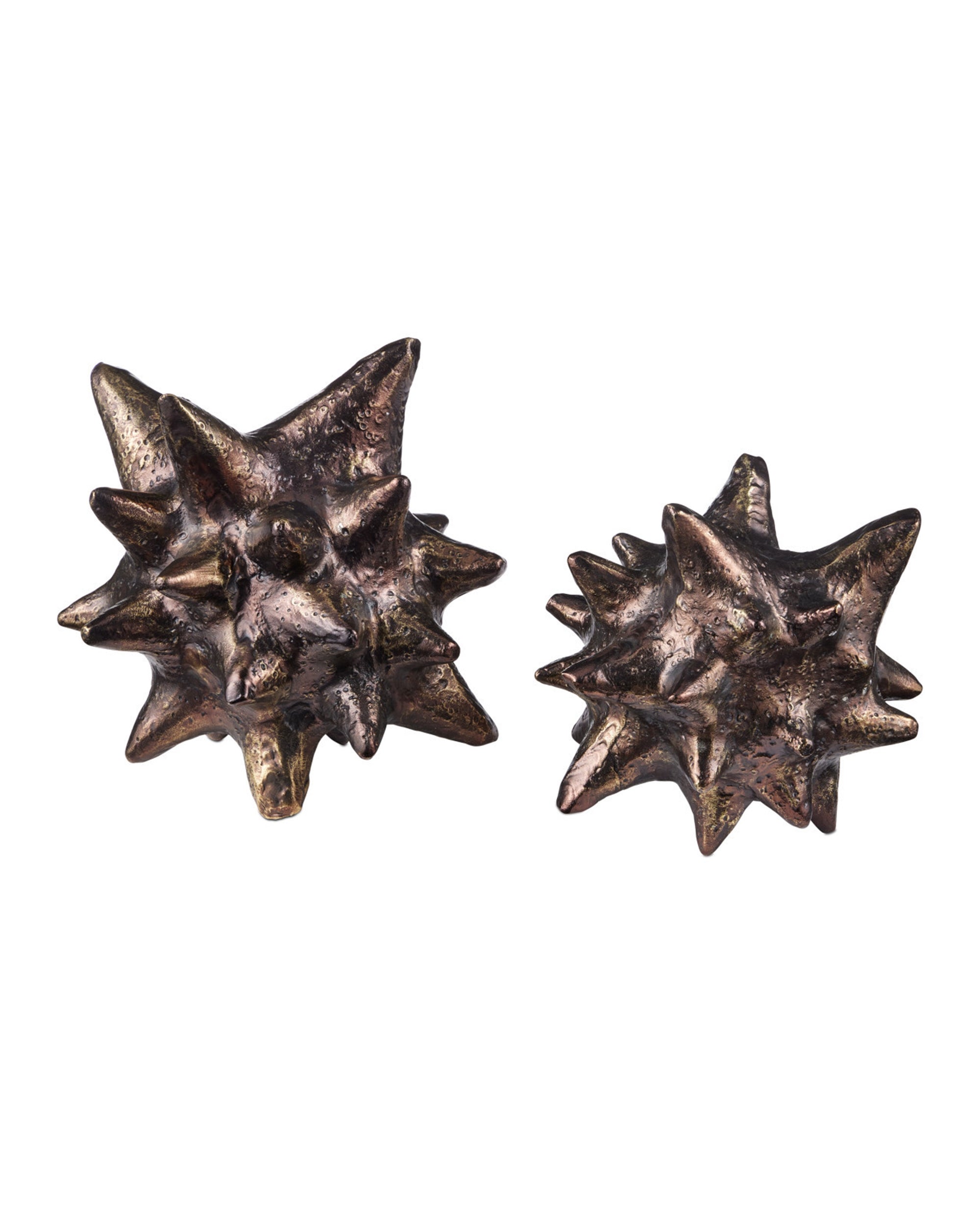 The Jacks Object by Currey & Company, Inc. features two metallic, star-shaped decorative pieces with spiked, textured surfaces, displayed side by side on a white background.